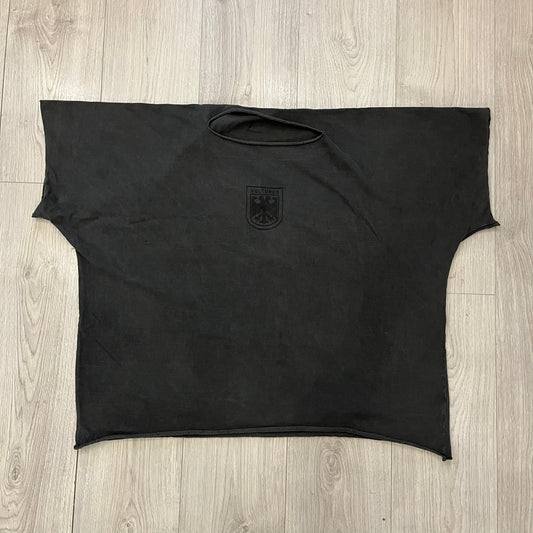 Kanye West Vultures Box Tee in washed black features a large Vultures Eagles logo on the back and a smaller matching logo on the chest. Designed with an oversized, boxy silhouette, this T-shirt offers a relaxed fit. Made from high-quality, durable materials, it provides comfort for everyday wear while showcasing Yeezy’s distinctive style.