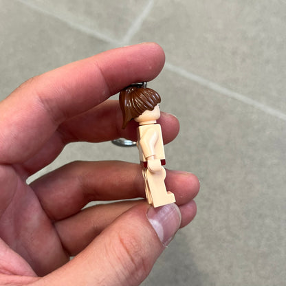 LEGO Star Wars 851938 Princess Leia Key Chain is a 2007 LEGO Gear accessory featuring a Princess Leia minifigure attached to a metal key ring and chain. The figure is permanently fixed to the chain and cannot be removed. The minifigure depicts Princess Leia in her bikini outfit from Jabba’s sail barge scene in Star Wars: Return of the Jedi.
