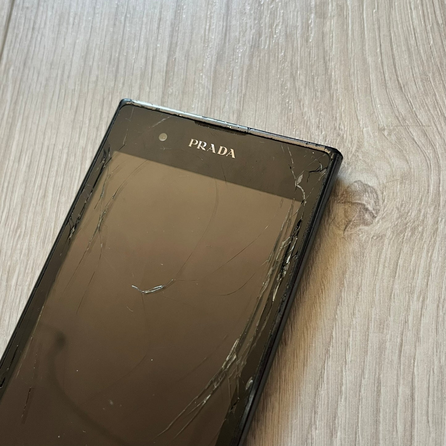 Non-functional LG Prada 3.0 P940 with cracked display, perfect for repair or as a display item. This model represents the last collaboration between LG and Prada, combining luxury design with early 2010s smartphone tech. A rare find despite its condition.