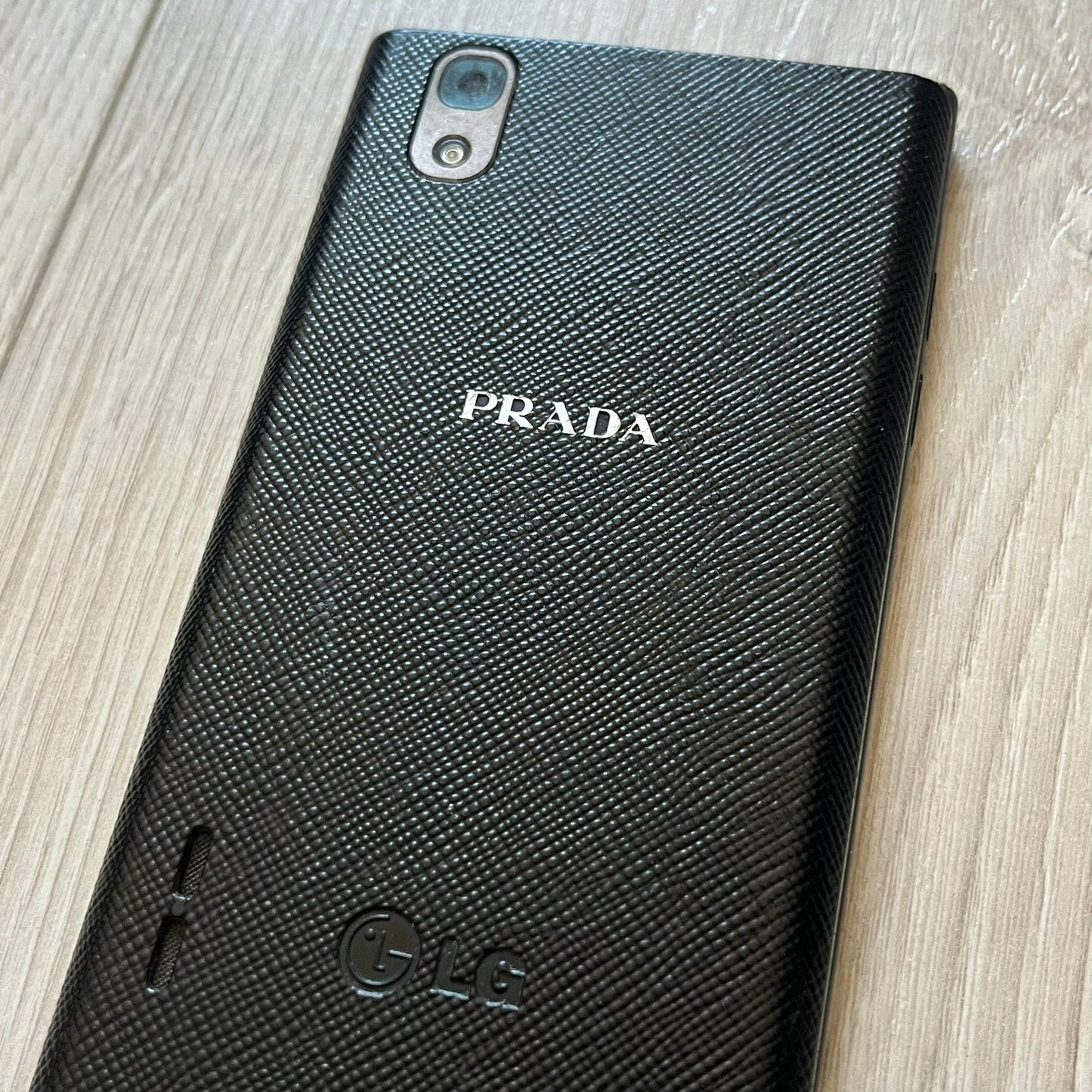 Non-functional LG Prada 3.0 P940 with cracked display, perfect for repair or as a display item. This model represents the last collaboration between LG and Prada, combining luxury design with early 2010s smartphone tech. A rare find despite its condition.