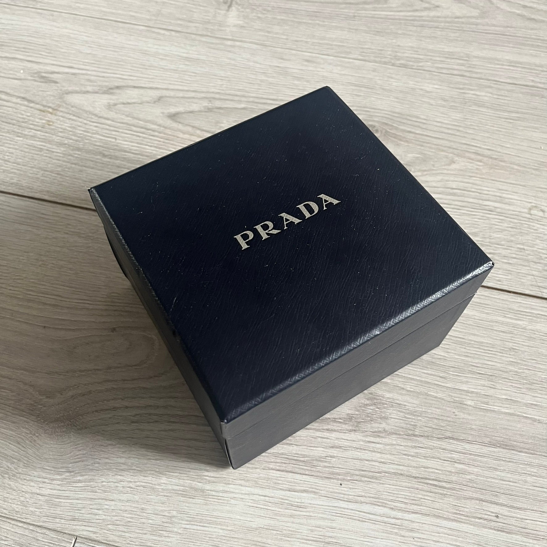 The LG Prada KE850, a groundbreaking collaboration between LG and Prada marked the world’s first capacitive touchscreen phone. Finished in sleek black with minimalist Prada aesthetics, it features media playback, Bluetooth, and expandable memory. Includes the full original Prada set: box, charger, cable, music device, manuals, and CD. Unlocked and functional for basic functions; for calling and texting you need your own SIM card.