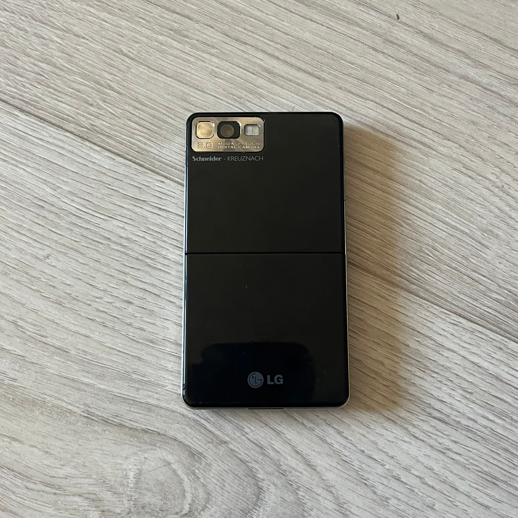 LG Prada KE850 touchscreen phone, the first of its kind with a capacitive display, designed in collaboration with Prada. Sleek black minimalist design, pre-loaded games, PDF and Office support, Bluetooth, and expandable memory. Comes complete with Prada box and leather etui - a collectible milestone in mobile fashion history.