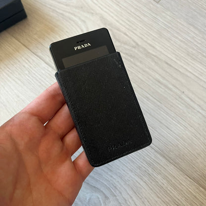 LG Prada KE850 touchscreen phone, the first of its kind with a capacitive display, designed in collaboration with Prada. Sleek black minimalist design, pre-loaded games, PDF and Office support, Bluetooth, and expandable memory. Comes complete with Prada box and leather etui - a collectible milestone in mobile fashion history.
