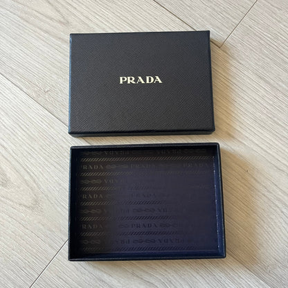 LG Prada KE850 touchscreen phone, the first of its kind with a capacitive display, designed in collaboration with Prada. Sleek black minimalist design, pre-loaded games, PDF and Office support, Bluetooth, and expandable memory. Comes complete with Prada box and leather etui - a collectible milestone in mobile fashion history.