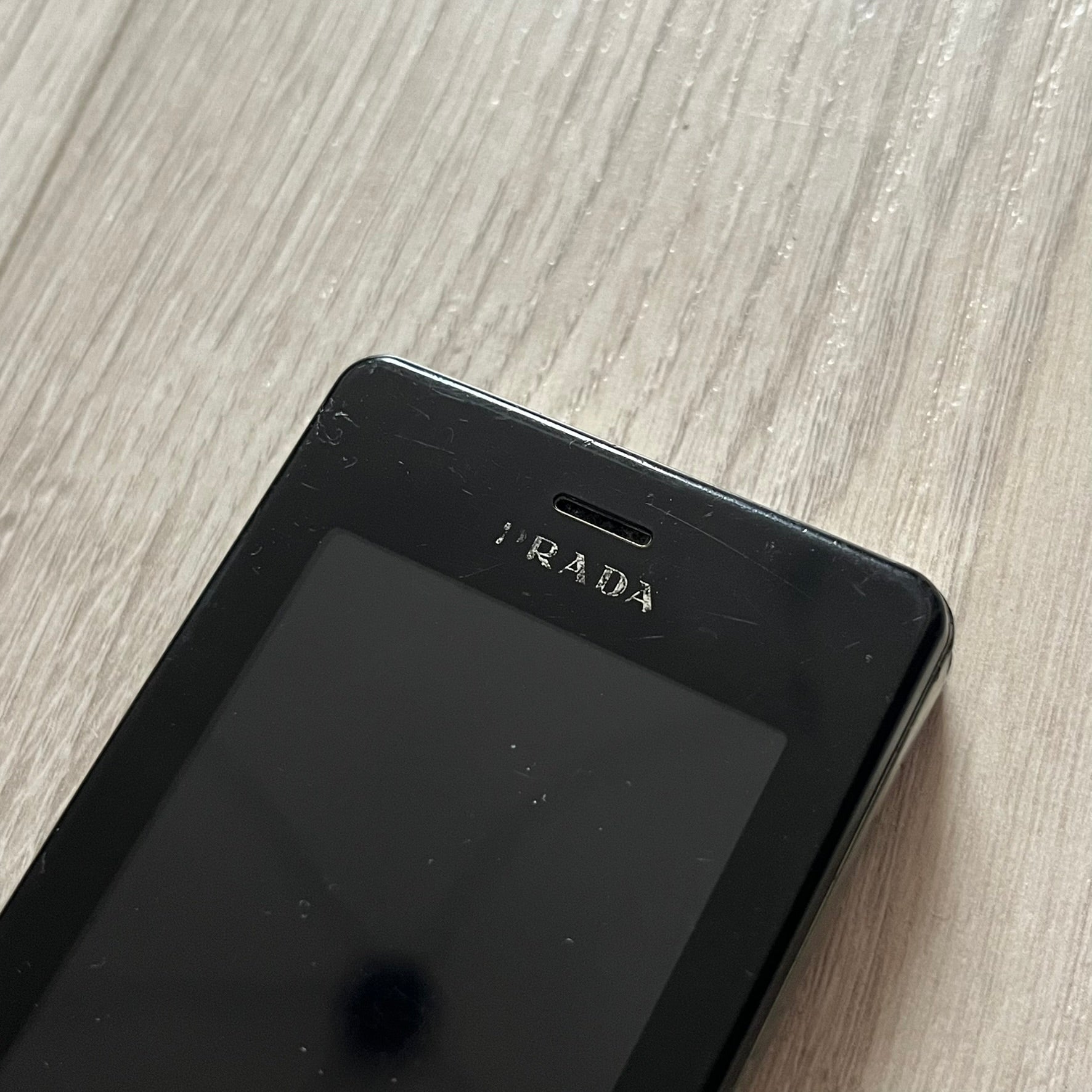 The LG Prada KE850, a groundbreaking collaboration between LG and Prada marked the world’s first capacitive touchscreen phone. Finished in sleek black with minimalist Prada aesthetics, it features media playback, Bluetooth, and expandable memory.&nbsp;