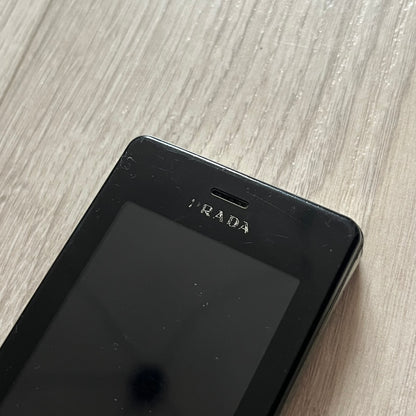 The LG Prada KE850, a groundbreaking collaboration between LG and Prada marked the world’s first capacitive touchscreen phone. Finished in sleek black with minimalist Prada aesthetics, it features media playback, Bluetooth, and expandable memory.&nbsp;