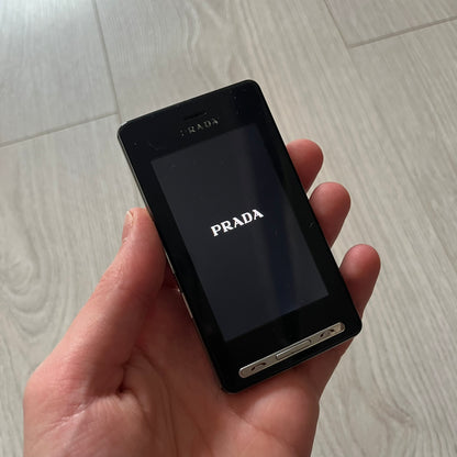 The LG Prada KE850, a groundbreaking collaboration between LG and Prada marked the world’s first capacitive touchscreen phone. Finished in sleek black with minimalist Prada aesthetics, it features media playback, Bluetooth, and expandable memory.&nbsp;