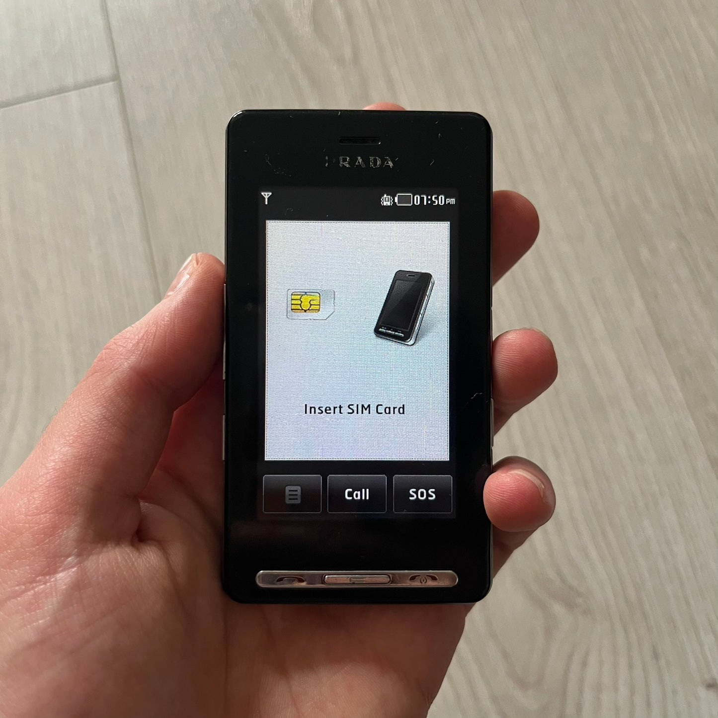 The LG Prada KE850, a groundbreaking collaboration between LG and Prada marked the world’s first capacitive touchscreen phone. Finished in sleek black with minimalist Prada aesthetics, it features media playback, Bluetooth, and expandable memory.&nbsp;