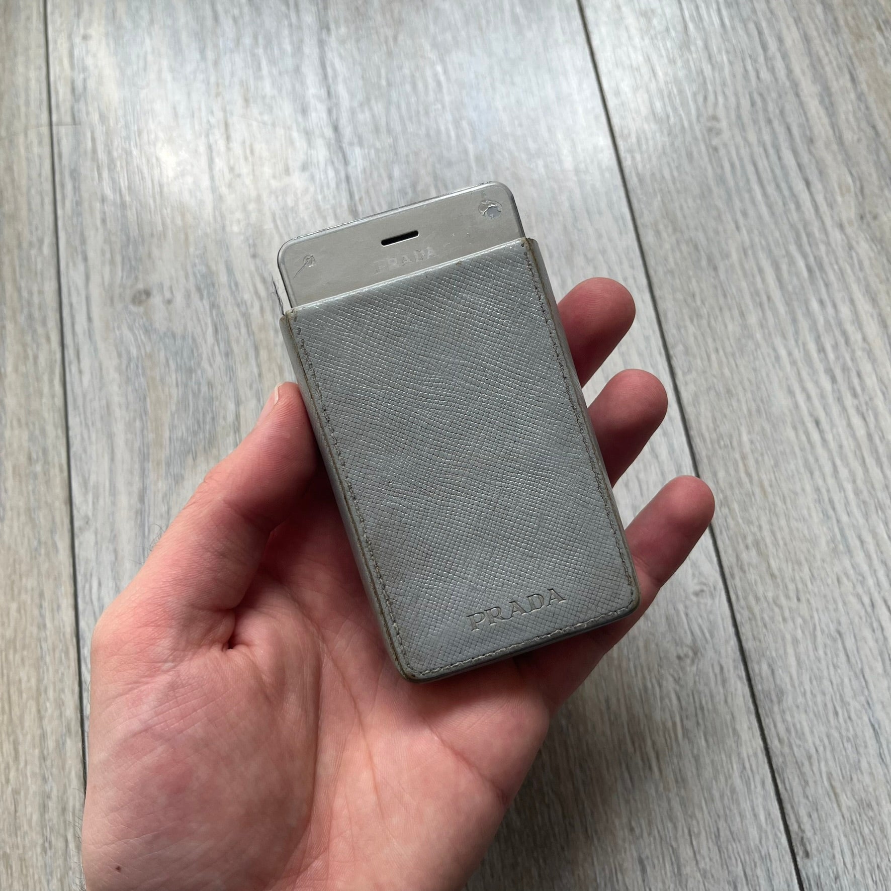 The LG Prada KE850, a groundbreaking collaboration between LG and Prada marked the world’s first capacitive touchscreen phone. Finished in silver and gray with minimalist Prada aesthetics, it features media playback, Bluetooth, and expandable memory. Sim locked.