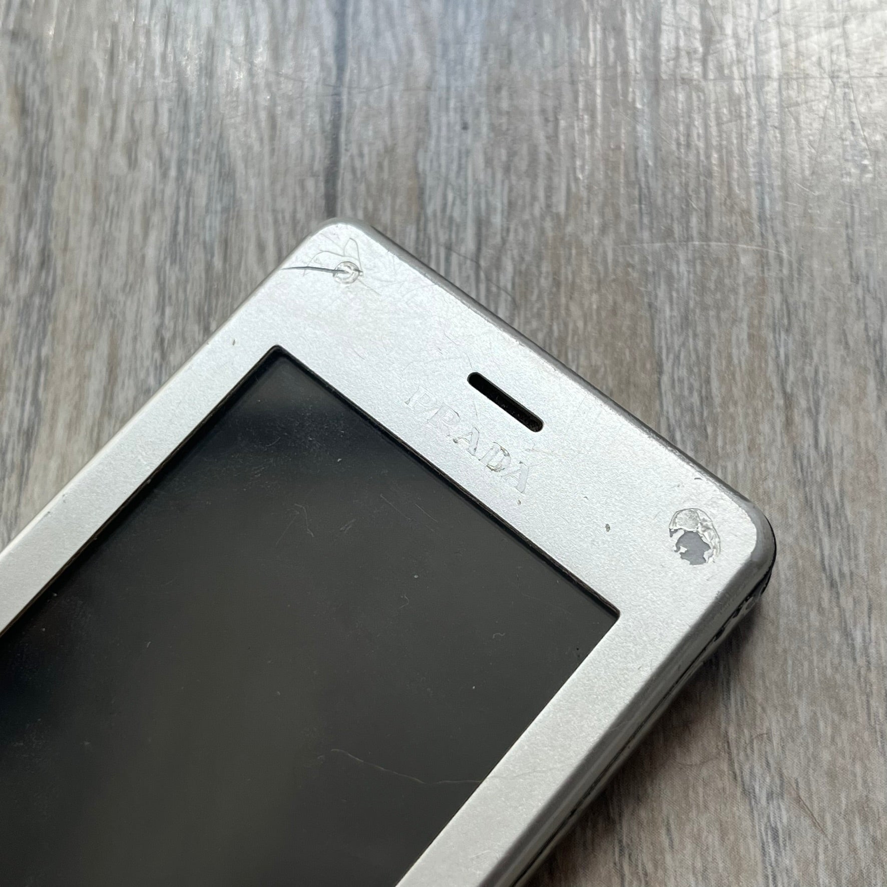 The LG Prada KE850, a groundbreaking collaboration between LG and Prada marked the world’s first capacitive touchscreen phone. Finished in silver and gray with minimalist Prada aesthetics, it features media playback, Bluetooth, and expandable memory. Sim locked.