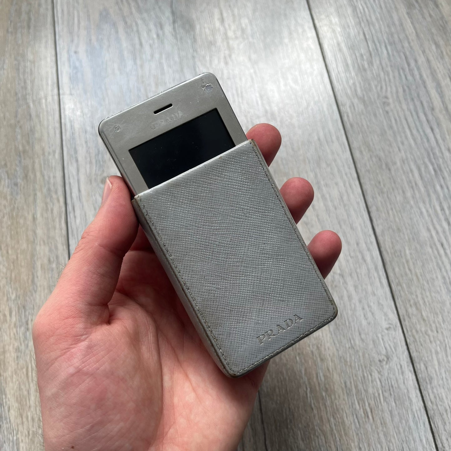 The LG Prada KE850, a groundbreaking collaboration between LG and Prada marked the world’s first capacitive touchscreen phone. Finished in silver and gray with minimalist Prada aesthetics, it features media playback, Bluetooth, and expandable memory. Sim locked.