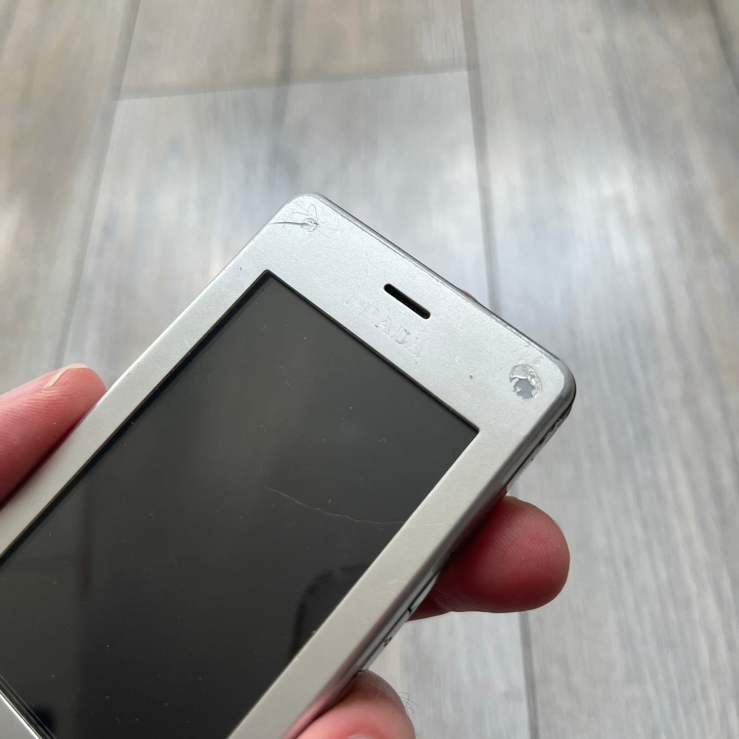 The LG Prada KE850, a groundbreaking collaboration between LG and Prada marked the world’s first capacitive touchscreen phone. Finished in silver and gray with minimalist Prada aesthetics, it features media playback, Bluetooth, and expandable memory. Sim locked.