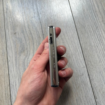 The LG Prada KE850, a groundbreaking collaboration between LG and Prada marked the world’s first capacitive touchscreen phone. Finished in silver and gray with minimalist Prada aesthetics, it features media playback, Bluetooth, and expandable memory. Sim locked.