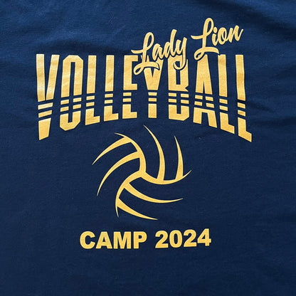 Navy blue t-shirt with gold 'Lady Lion Volleyball Camp 2024' text and volleyball design.