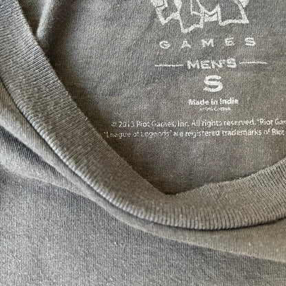 League of Legends 2013 Pixel Team Gray Tee is a gray T-shirt featuring a full five-champion team (Garen, Master Yi, Ahri, Ashe, and Kayle) rendered in pixel art style on the front. The upper back shows League main Logo. Licensed 2013 neck tag with the old Riot Games logo.