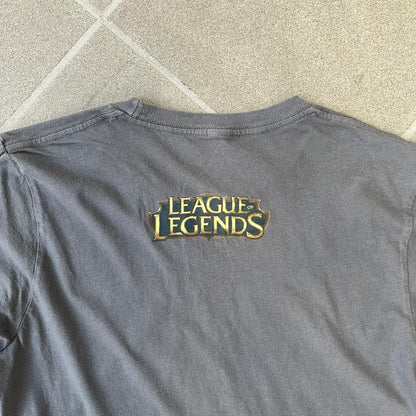 League of Legends 2013 Pixel Team Gray Tee is a gray T-shirt featuring a full five-champion team (Garen, Master Yi, Ahri, Ashe, and Kayle) rendered in pixel art style on the front. The upper back shows League main Logo. Licensed 2013 neck tag with the old Riot Games logo.