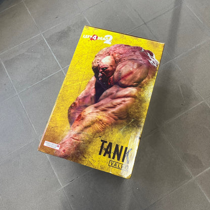 Left 4 Dead 2: Tank 2011 Exclusive Gaming Heads Statue is a limited edition poly-stone collectible based on the Tank character from Left 4 Dead 2. The statue is hand finished and hand painted, depicting the Tank smashing through a reinforced door with glow-in-the-dark painted eyes. It measures approximately 15 inches tall including the base and was limited to 300 pieces worldwide. This exclusive version comes with additional to scale Pump Shotgun that wasn't added in the standard edition. This piece is numb