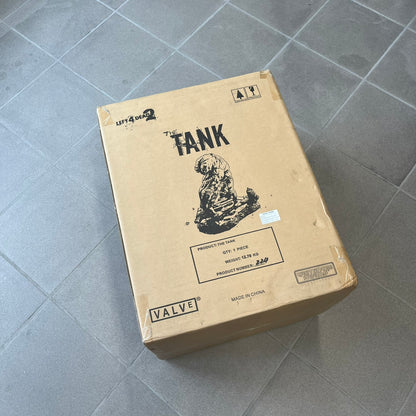 Left 4 Dead 2 Tank 2011 Gaming Heads Statue is a limited edition poly-stone collectible based on the Tank character from Left 4 Dead 2. The statue is hand finished and hand painted, depicting the Tank smashing through a reinforced door with glow-in-the-dark painted eyes. It measures approximately 15 inches tall including the base and was limited to 750 pieces worldwide. This piece is number 224 and comes with the original shipping box, styrofoam packaging, colored box, and identification/validation card.
