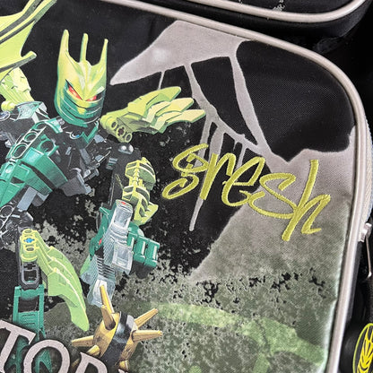 Lego Bionicle 2010 Glatorian Gresh Backpack made by Class Investment in 2010, featuring a front pocket with an embroidered Glatorian Gresh figure and text. The top pocket includes both Bionicle and LEGO logos, along with custom rubber zipper pulls. Finished with two side bottle pockets and additional Bionicle logo details, making it a great rare collectible for fans of the series.