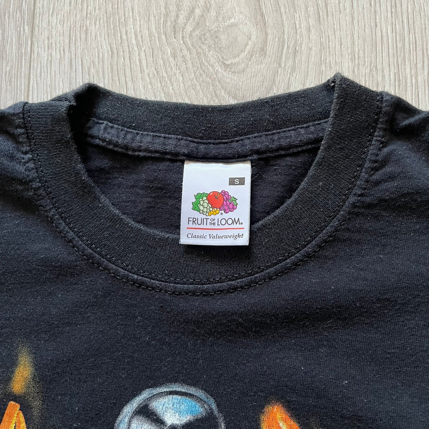 Rare 2000s Lego Bionicle T-shirt showcasing Toa Hordika Vakama from the 2005 set. Features the glowing Bionicle logo under the Binicle, small Lego branding and a naturally sunfaded black wash. A collectible tee that perfectly captures early-2000s nostalgia.