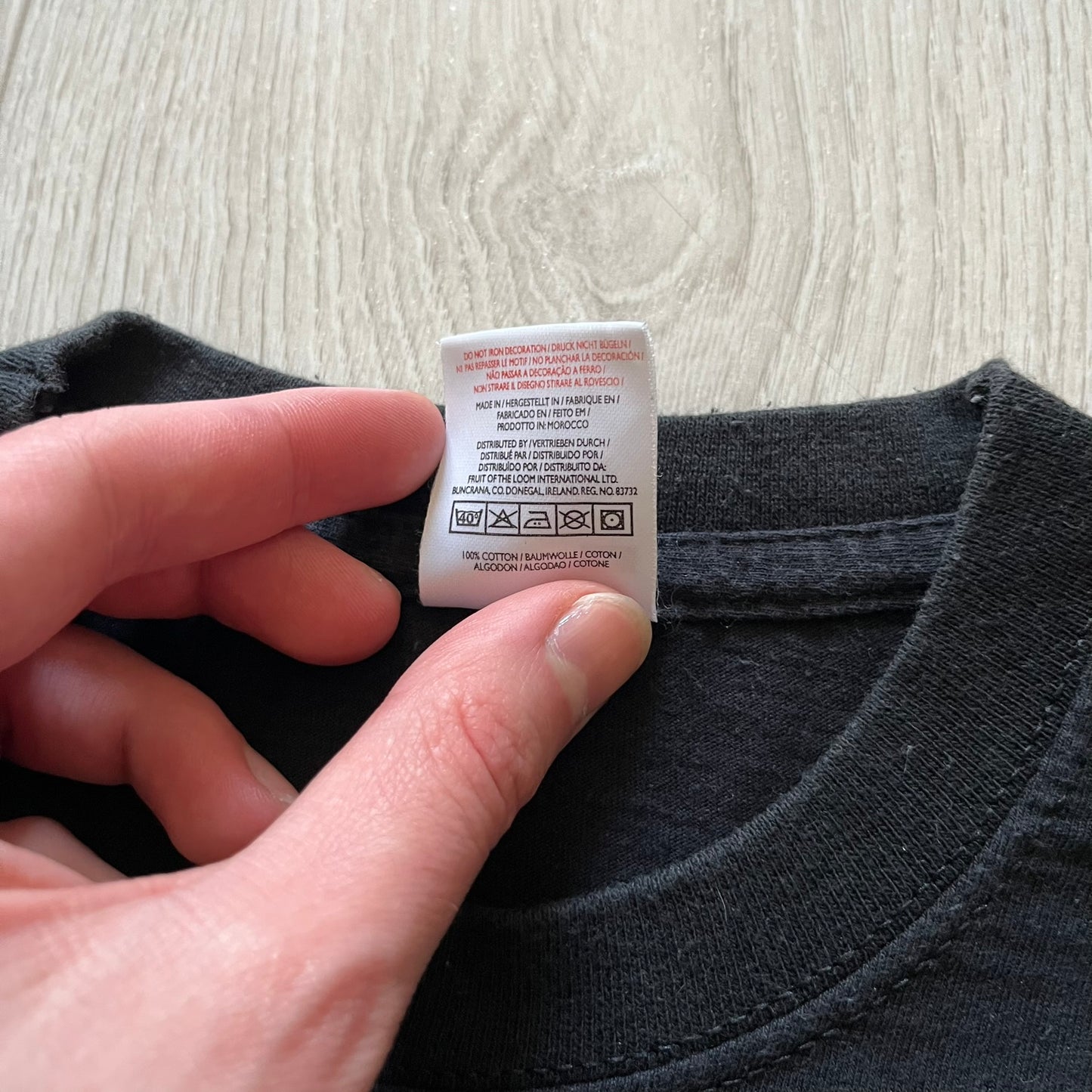 Rare 2000s Lego Bionicle T-shirt showcasing Toa Hordika Vakama from the 2005 set. Features the glowing Bionicle logo under the Binicle, small Lego branding and a naturally sunfaded black wash. A collectible tee that perfectly captures early-2000s nostalgia.