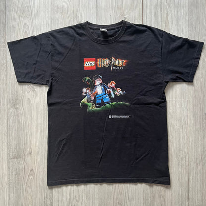 Black t-shirt with LEGO Harry Potter graphic on a wooden surface