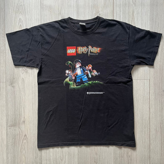Black t-shirt with LEGO Harry Potter graphic on a wooden surface
