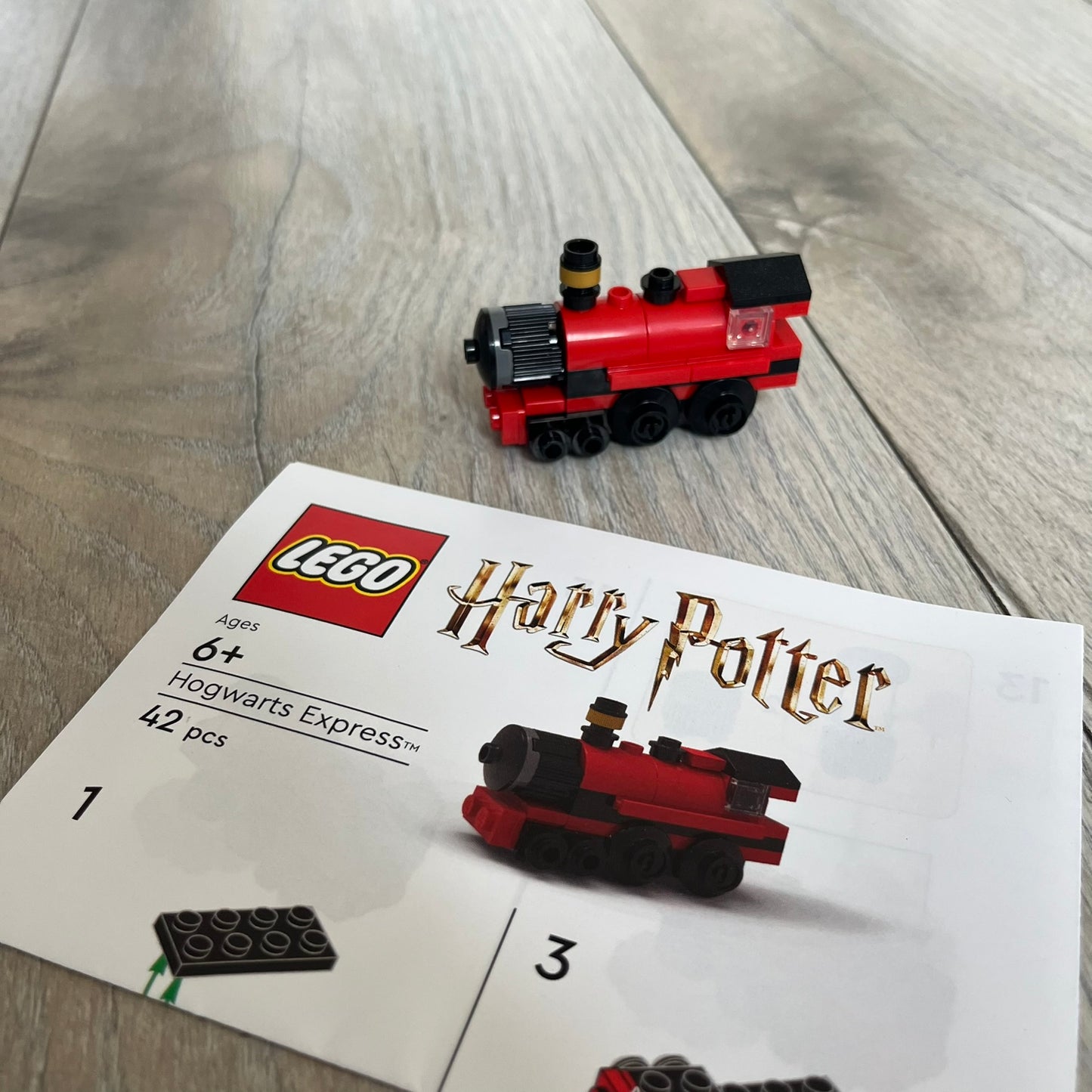 LEGO Hogwarts Express Make and Take Build is a limited promotional LEGO set distributed as an exclusive “make & take” event and not available for retail purchase. The model features a small version of the red Hogwarts Express train from the Harry Potter series, with basic rolling wheels.
