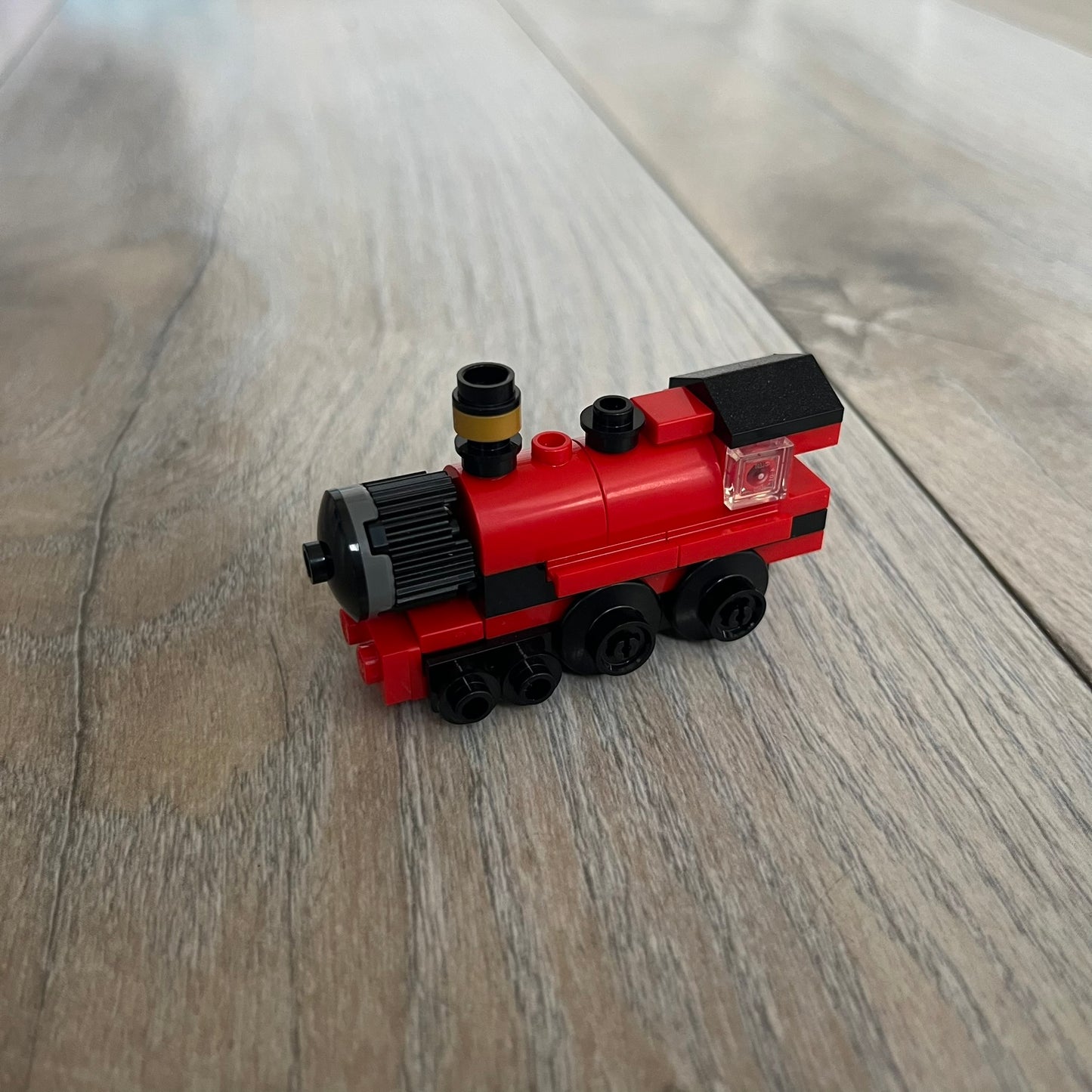 LEGO Hogwarts Express Make and Take Build is a limited promotional LEGO set distributed as an exclusive “make & take” event and not available for retail purchase. The model features a small version of the red Hogwarts Express train from the Harry Potter series, with basic rolling wheels.
