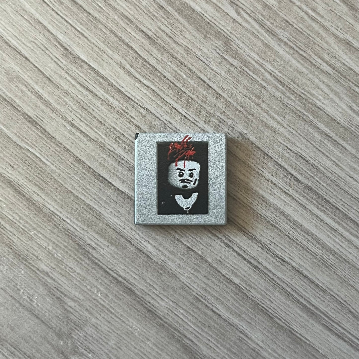 Lego Playboi Carti “Whole Lotta Red” minifigure featuring the Carti with red dreads from the album era. The figure is displayed on a paper/cartboard display accompanied by a small plate of the Lego style album cover, a limited addition only for first orders. A collectible piece from TheCanvasDon.