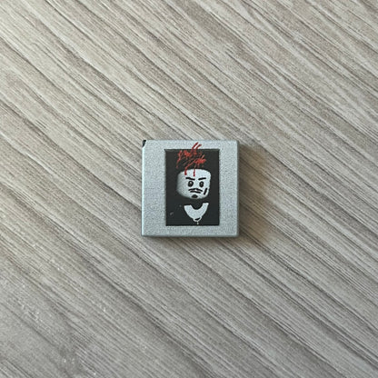 Lego Playboi Carti “Whole Lotta Red” minifigure featuring the Carti with red dreads from the album era. The figure is displayed on a paper/cartboard display accompanied by a small plate of the Lego style album cover, a limited addition only for first orders. A collectible piece from TheCanvasDon.