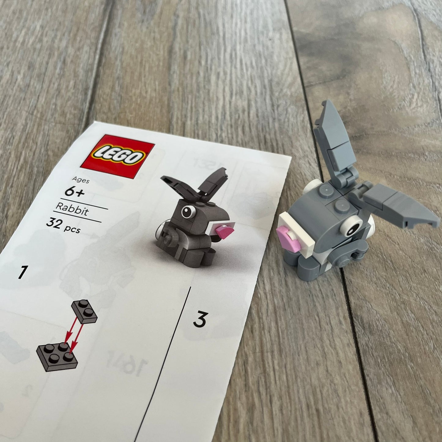 LEGO Rabbit Make and Take Build is a limited promotional LEGO set distributed as an exclusive “make & take” event and not available for retail purchase. The model features a small grey and white rabbit with movable ears and articulated front limbs.
