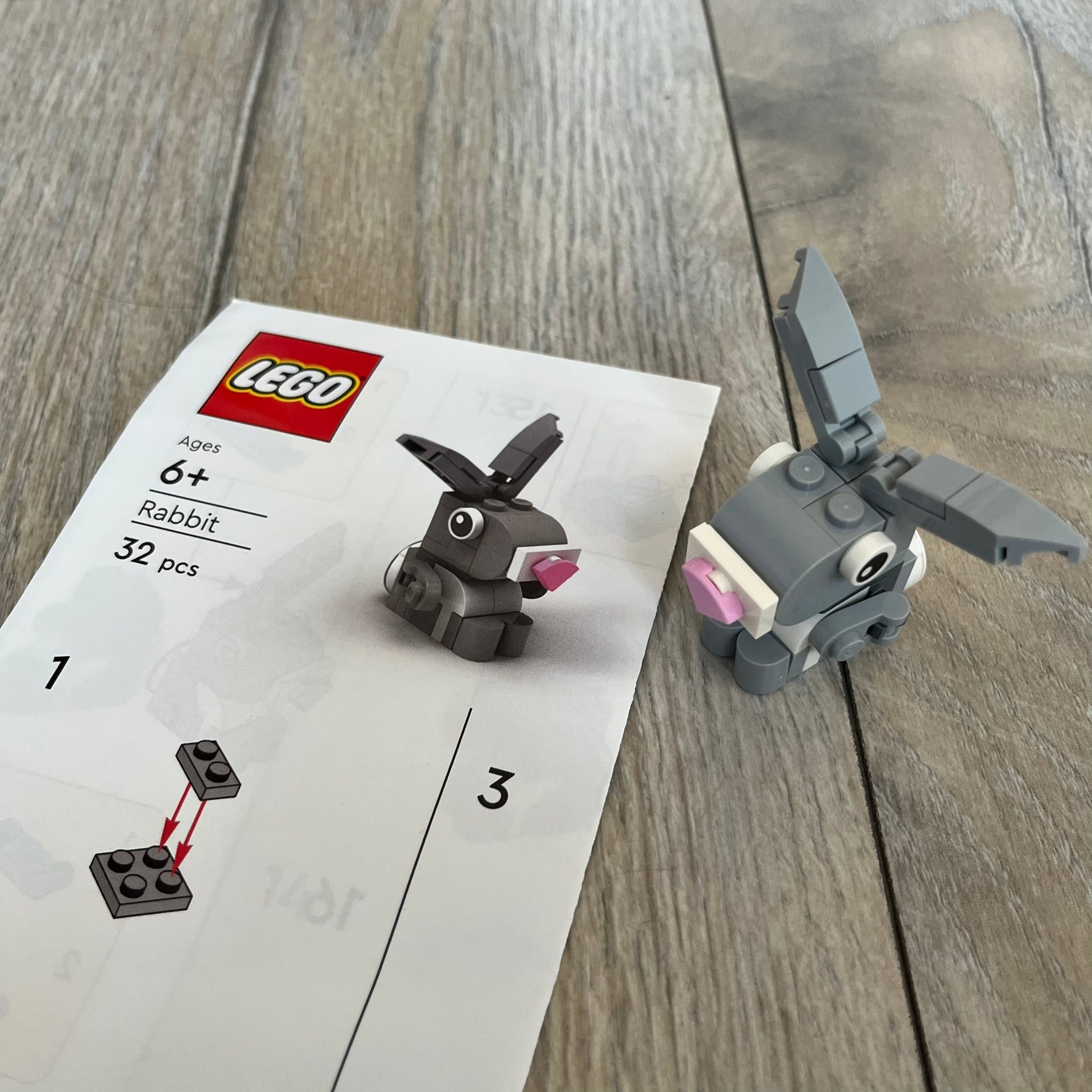 LEGO Rabbit Make and Take Build is a limited promotional LEGO set distributed as an exclusive “make & take” event and not available for retail purchase. The model features a small grey and white rabbit with movable ears and articulated front limbs.

