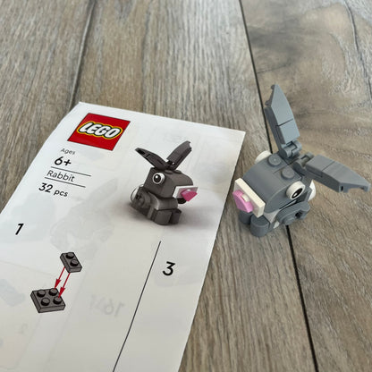 LEGO Rabbit Make and Take Build is a limited promotional LEGO set distributed as an exclusive “make & take” event and not available for retail purchase. The model features a small grey and white rabbit with movable ears and articulated front limbs.
