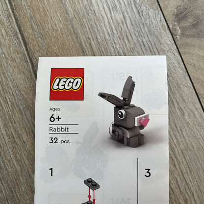 LEGO Rabbit Make and Take Build is a limited promotional LEGO set distributed as an exclusive “make & take” event and not available for retail purchase. The model features a small grey and white rabbit with movable ears and articulated front limbs.

