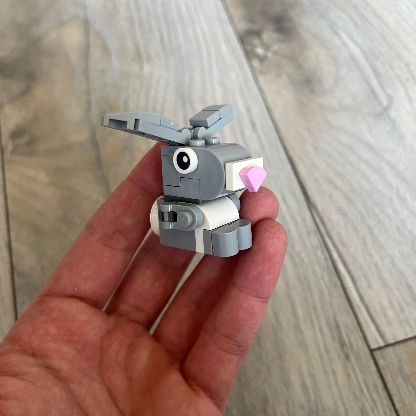 LEGO Rabbit Make and Take Build is a limited promotional LEGO set distributed as an exclusive “make & take” event and not available for retail purchase. The model features a small grey and white rabbit with movable ears and articulated front limbs.
