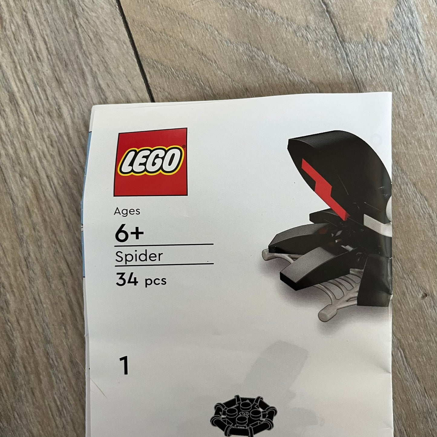 LEGO Spider Make and Take Build is a limited promotional LEGO set distributed as an exclusive “make & take” event and not available for retail purchase. The model features a black spider build with movable legs attached to a web element for display.