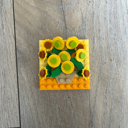 LEGO Sunflowers Make and Take Build is a limited promotional LEGO set distributed as an exclusive “make & take” event and not available for retail purchase. The model features a small 3D interpretation of sunflowers inspired by the famous painting, arranged in a way that resembles the artwork when viewed from above.