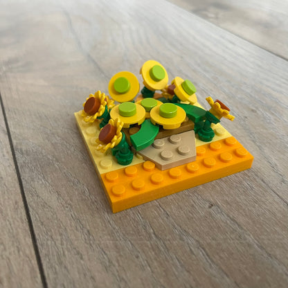 LEGO Sunflowers Make and Take Build is a limited promotional LEGO set distributed as an exclusive “make & take” event and not available for retail purchase. The model features a small 3D interpretation of sunflowers inspired by the famous painting, arranged in a way that resembles the artwork when viewed from above.