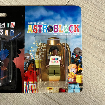 Lego Travis Scott Minifigures Triple Pack featuring three custom figures: Brick Rodeo, Bricks in the Trap, and Astroblock, each inspired and styled after Travis Scott’s iconic album eras. All three are sealed and mounted on a single display card with matching Lego album artwork, a collectible piece created by TheCanvasDon.