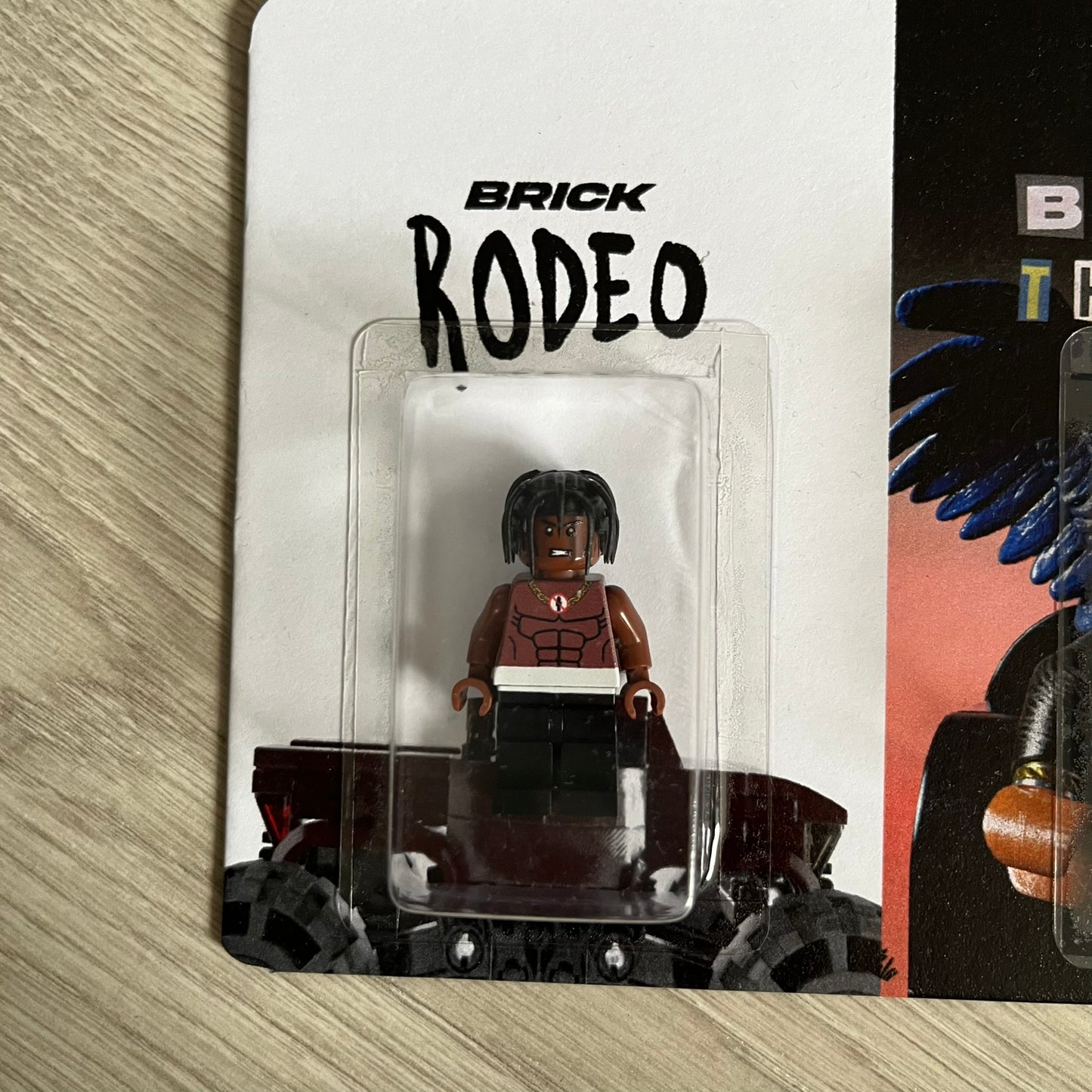 Lego Travis Scott Minifigures Triple Pack featuring three custom figures: Brick Rodeo, Bricks in the Trap, and Astroblock, each inspired and styled after Travis Scott’s iconic album eras. All three are sealed and mounted on a single display card with matching Lego album artwork, a collectible piece created by TheCanvasDon.