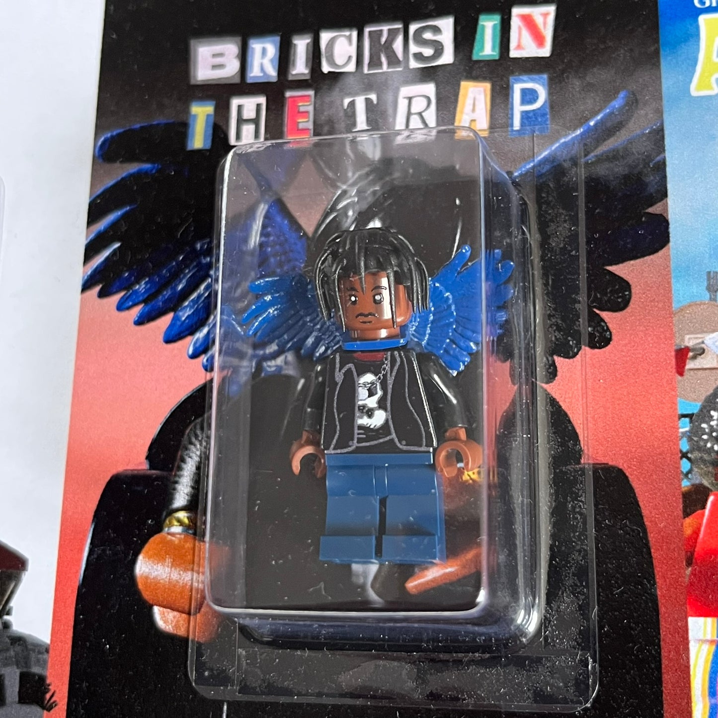 Lego Travis Scott Minifigures Triple Pack featuring three custom figures: Brick Rodeo, Bricks in the Trap, and Astroblock, each inspired and styled after Travis Scott’s iconic album eras. All three are sealed and mounted on a single display card with matching Lego album artwork, a collectible piece created by TheCanvasDon.