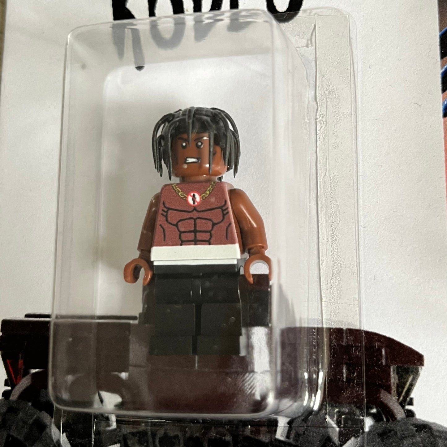 Lego Travis Scott Minifigures Triple Pack featuring three custom figures: Brick Rodeo, Bricks in the Trap, and Astroblock, each inspired and styled after Travis Scott’s iconic album eras. All three are sealed and mounted on a single display card with matching Lego album artwork, a collectible piece created by TheCanvasDon.