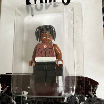 Lego Travis Scott Minifigures Triple Pack featuring three custom figures: Brick Rodeo, Bricks in the Trap, and Astroblock, each inspired and styled after Travis Scott’s iconic album eras. All three are sealed and mounted on a single display card with matching Lego album artwork, a collectible piece created by TheCanvasDon.