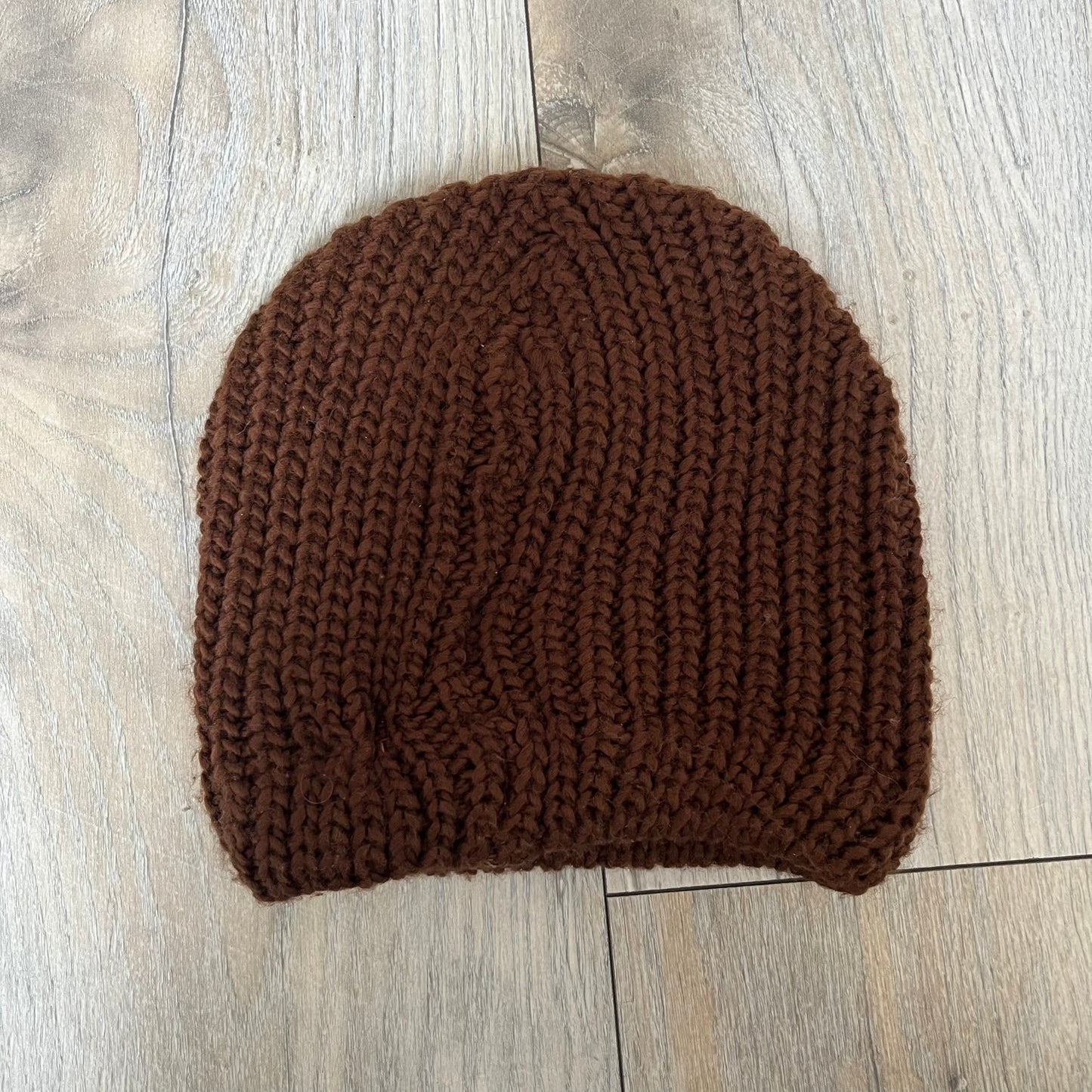 LittleBigPlanet 2009 Europe Exclusive Sackboy Beanie is an officially licensed brown knit beanie made from 100% acrylic. The design is styled after Sackboy and features a beige front tag with an orange Sackboy figure, LittleBigPlanet logo, and SCEE 2009 licensing. This item was released exclusively in the European region. Super rare and rarely seen for sale.
