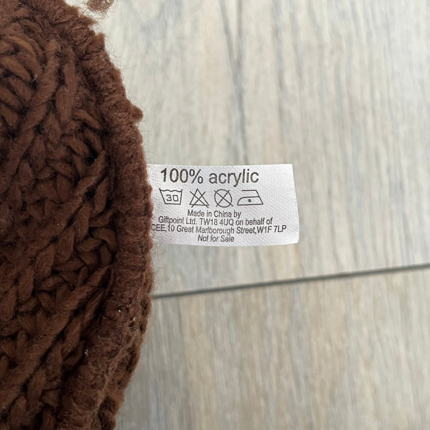 LittleBigPlanet 2009 Europe Exclusive Sackboy Beanie is an officially licensed brown knit beanie made from 100% acrylic. The design is styled after Sackboy and features a beige front tag with an orange Sackboy figure, LittleBigPlanet logo, and SCEE 2009 licensing. This item was released exclusively in the European region. Super rare and rarely seen for sale.