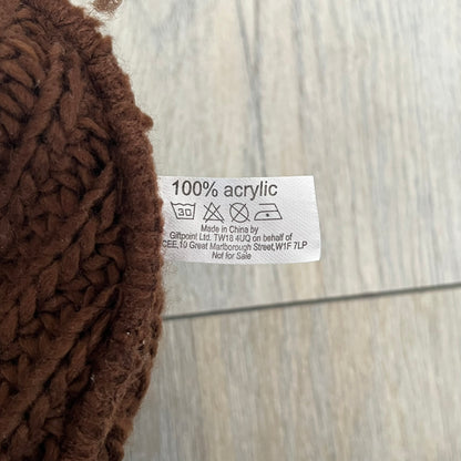 LittleBigPlanet 2009 Europe Exclusive Sackboy Beanie is an officially licensed brown knit beanie made from 100% acrylic. The design is styled after Sackboy and features a beige front tag with an orange Sackboy figure, LittleBigPlanet logo, and SCEE 2009 licensing. This item was released exclusively in the European region. Super rare and rarely seen for sale.