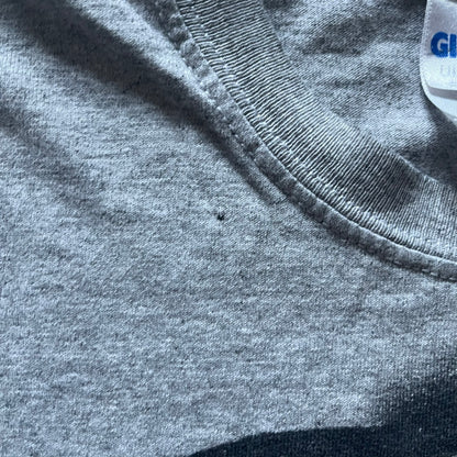 Very-rare Little Big Planet t-shirt from 2010, made on a Gildan Ultra Cotton. Showcases a graffiti like print with Sackboy and LBP logo branding in the bottom right corner with SCEE licensing. One of the rarest LBP pieces, this t-shirt is a true grail for fans and collectors.