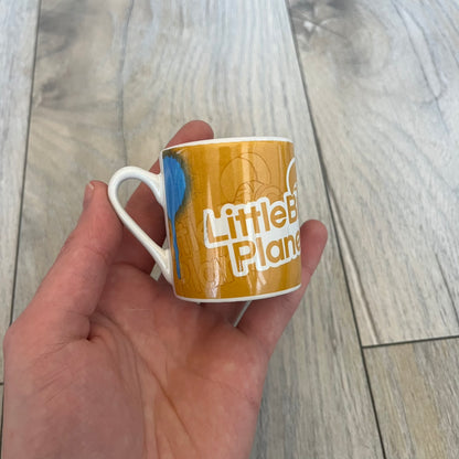 LittleBigPlanet 2011 Collectable Mini Mugs + Saucers Set is a 4-piece espresso set featuring characters from the LittleBigPlanet series, including Sackboy, Marvin the Disco Dancer, Gloria, and Yuri Army Sackboy. Each mini mug includes a wraparound character graphic with the LittleBigPlanet logo and comes with a matching saucer printed on the top. The set is officially licensed by Sony Computer Entertainment, includes a display box, and carries SCEE 2011 licensing on the base of the mugs and saucers.