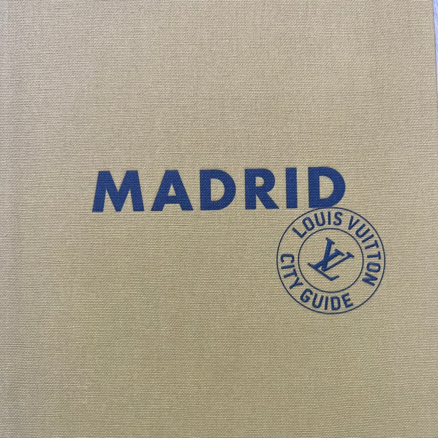 Louis Vuitton “Madrid” City Guide is a 320-page English-language travel book with cloth binding. It features contributions from writers Stephen Phelan, Ian Mount, Michael Stothard, and Joanna Wivell, with a special guest contribution from Sara Hurtado. Photography is provided by Mat Jacob of the Tendance Floue collective, offering curated insights into Madrid’s hotels, restaurants, cultural landmarks, and creative hubs